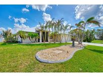 Single-Gathering home with palm trees and landscaped yard at 1219 Nantucket Rd, Venice, FL 34293