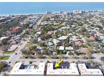 Scenic aerial view of the neighborhood near the beach, showcasing the coastal community and nearby beachfront hotels at 210 Park N Blvd # 129, Venice, FL 34285
