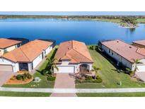 Aerial view of single-Gathering home with lake access and community view at 24176 Spartina Dr, Venice, FL 34293