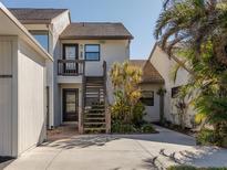 Two-story condo building with private entrance and stairs at 694 Bird Bay W Dr # 137, Venice, FL 34285