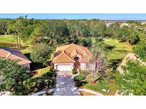 Single-story house with tile roof and attached garage at 2331 Harrier Way, Nokomis, FL 34275