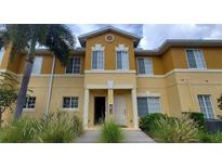 Exterior view of a two-story building with tan walls and white trim at 12924 Tigers Eye Dr, Venice, FL 34292