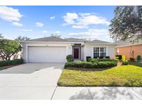 One-story house with a two-car garage and landscaped yard at 5198 Layton Dr, Venice, FL 34293