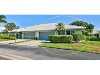 Charming single-story villa with a two-car garage, tidy landscaping and a bright white roof in a sunny neighborhood at 3117 Heron Shores Dr, Venice, FL 34293