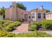 Charming home featuring a tile roof, stucco exterior, and landscaped front yard at 321 Pedro St, Venice, FL 34285