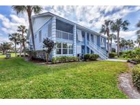 Charming two-story condo with lush landscaping and a beautiful lawn at 454 Cerromar Rd # 172, Venice, FL 34293