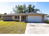 Charming single-story home featuring a large two-car garage and well-maintained landscaping at 781 Missouri Rd, Venice, FL 34293