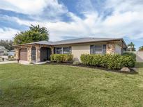Charming single-story home with a well-manicured lawn and stone accents at 1200 Yawl Way, Venice, FL 34285