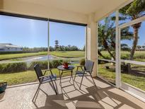 Relax on the screened lanai with views of the golf course and beautiful landscaping at 2602 Ravinia Cir # 2602, Venice, FL 34292