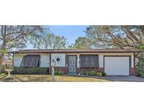 Charming single-story home featuring a well-maintained front yard and attached one car garage at 8155 Mossborger Ave, North Port, FL 34287
