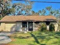 Quaint single-story home featuring a well-maintained lawn and established landscaping at 270 W Baffin Dr, Venice, FL 34293