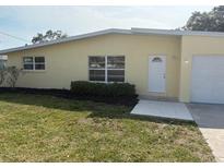 Charming single-story home featuring a well-maintained lawn and inviting front entrance at 501 Dona Dr, Nokomis, FL 34275