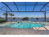 Beautiful screened pool with lake view, perfect for relaxing and entertaining outdoors at 448 Bocelli Dr, Nokomis, FL 34275
