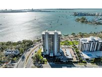 Stunning aerial view of waterfront condo with bay views and city skyline at 770 S Palm Ave # 404, Sarasota, FL 34236