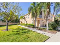 Charming townhome with lush landscaping, mature trees, and a private front porch at 3691 Parkridge Cir # 201, Sarasota, FL 34243