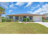 Charming single-story home with well-maintained lawn and landscaped front yard, offering great curb appeal at 761 Vivienda South Ct # 14, Venice, FL 34293