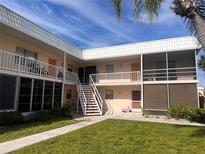 Charming condo with well-maintained lawns, private patios, and bright, open living spaces at 460 Base E Ave # 129, Venice, FL 34285