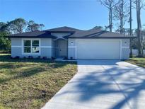 Charming one-story home with a two-car garage and well-maintained lawn at 4595 Horseshoe Ave, North Port, FL 34286