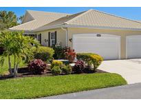 Charming one-story home featuring a well-manicured lawn and a convenient two-car garage at 1567 Monarch Dr, Venice, FL 34293