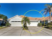 Charming single-story home featuring a spacious driveway, two-car garage, and well-maintained landscaping at 1808 San Silvestro Dr, Venice, FL 34285