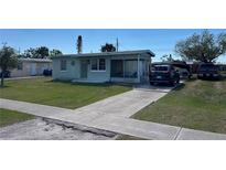 Charming single-story home with a screened porch and a long driveway at 8629 Aero Ave, North Port, FL 34287