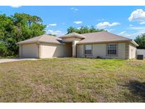 Charming single-story home with a two-car garage and well-maintained lawn in a peaceful setting at 3590 Lookout Ln, North Port, FL 34288