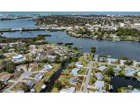 Beautiful aerial view of the waterfront property, showcasing canal access and proximity to the bay and Gulf of Mexico at 504 Buena Vista Dr, Nokomis, FL 34275