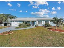 Charming single story home with well-manicured lawn and mature landscaping at 8432 Culebra Ave, North Port, FL 34287