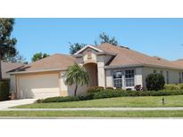 Charming single-story home featuring a well-manicured lawn, neutral color scheme, and attached two-car garage at 5255 Layton Dr, Venice, FL 34293