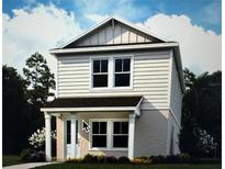 Charming two-story home featuring neutral siding, a covered entry, and verdant landscaping at 145 Thorne Ln, Sarasota, FL 34240