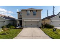 Charming two-story home with a well-manicured lawn and inviting curb appeal at 4907 Wedgeleaf Way, Palmetto, FL 34221