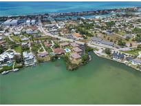 Stunning aerial view of waterfront homes and community with ocean access and serene bay waters at 101 Louella Ln # 11, Nokomis, FL 34275