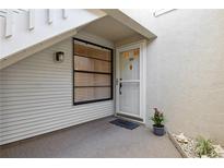 Charming condo entryway with white door, decorative accents, and a cozy welcome mat at 930 Capri Isles Blvd # 120, Venice, FL 34292