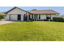 Charming one-story home with well-maintained lawn and inviting curb appeal at 1231 Pine Needle Rd, Venice, FL 34285