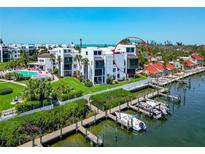 Beautiful waterfront home featuring a marina, lush landscaping, and community pool at 2955 N Beach Rd # A422, Englewood, FL 34223