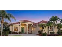 Charming single-story home with a tile roof, manicured landscaping, and a welcoming front entrance at 4326 Corso Venetia Blvd, Venice, FL 34293