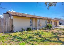 Charming single-story home featuring a well-maintained lawn, neutral paint, and a welcoming facade at 5755 Oxalis Rd, Venice, FL 34293