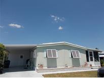 Charming single-story home with well-maintained lawn and covered carport at 358 Longwood Dr, Venice, FL 34285