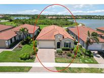 Well-maintained home with tile roof, manicured lawn, and attractive landscaping in a desirable community at 10618 Corkwood Ct, Venice, FL 34293