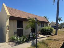 Charming single-story home with a well-manicured lawn and welcoming walkway at 469 Albee Farm Rd # V19, Venice, FL 34285