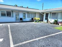 Charming condo exterior with parking and maintained landscaping at 525 Manatee Ct # 13, Venice, FL 34285