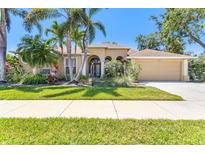 Stunning single-Gathering home showcasing lush landscaping and a charming exterior at 622 Pine Ranch East Rd, Osprey, FL 34229