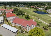 Beautiful aerial view of condo, golf course, and ponds on a sunny day at 770 Village Cir # 232, Venice, FL 34292