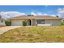 Charming single-story home featuring a well-manicured lawn and an attached two-car garage at 2311 Sandlewood Dr, Venice, FL 34293