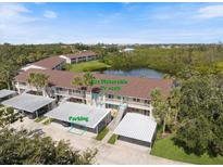 Charming condo with covered parking and lake views in a desirable community, close to beaches at 821 Waterside Dr # 205, Venice, FL 34285
