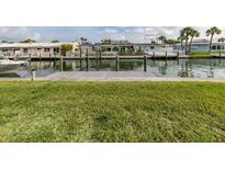 Waterfront property featuring a dock and scenic canal views at 832 Whitecap Cir # 5, Venice, FL 34285