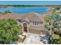 Stunning two-story home with a three car garage and lake view at 632 Tanana Fall Dr, Ruskin, FL 33570