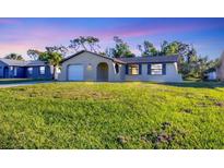 Charming single-Gathering home with a well-maintained lawn and attached one car garage at 1032 Elaine St, Venice, FL 34285