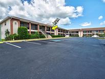 Well-maintained two-story condo building with ample parking and inviting entrances at 1531 Placida Rd # 202 Building 9, Englewood, FL 34223