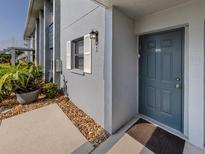 A cozy entrance welcomes you with well maintained landscape features and a well lit doorway at 25050 Sandhill Blvd # 6A3, Punta Gorda, FL 33983